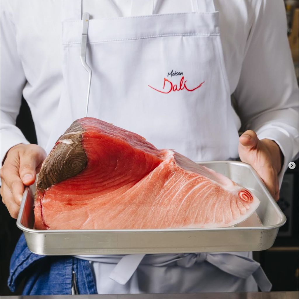 Chef preparing premium tuna at Maison Dali - exemplifying exceptional ingredient sourcing